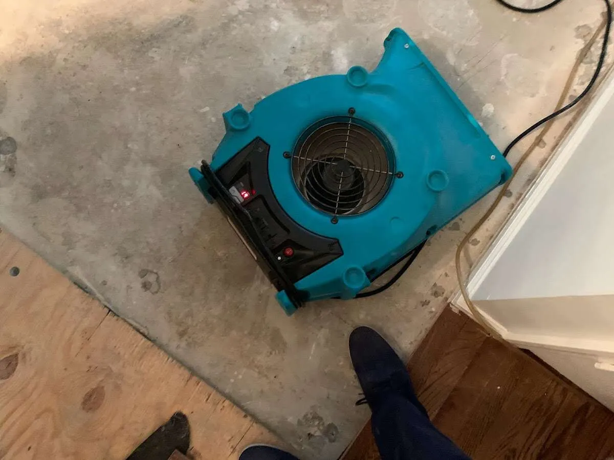 Air mover drying subfloor during Leak Detection & Repair in Sausalito